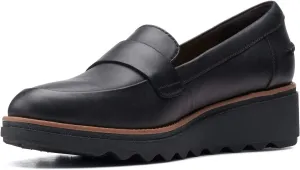 Clarks womens Sharon Gracie Penny Loafer, Black Leather With Dark Tan Welt, 7.5 US